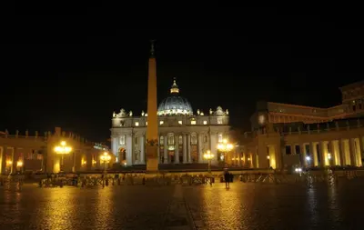 a building with a tower in front of it at night at Dal Pontefice in Rome