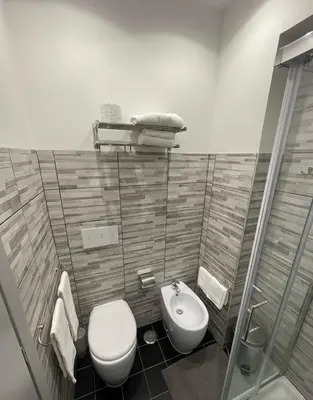 a bathroom with a toilet and a sink at Residenza Cola Di Rienzo - Suite In Rome in Rome