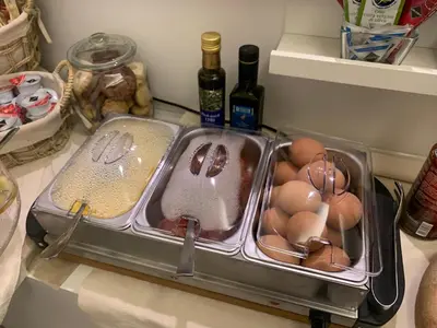 a sink with eggs in it in a refrigerator at Domus Terenzio in Rome