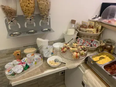 a kitchen counter with several plates of food on it at Domus Terenzio in Rome