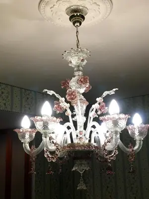 a chandelier is hanging from a ceiling at Residenza Ave Roma in Rome