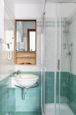 a bathroom with a sink and a shower at Residenza Vaticana in Rome