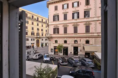 a view of a city street with cars and buildings at MoMo Vatican Museums in Rome