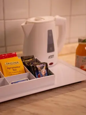 a counter top with a coffee maker and some food at Navona Little Home in Rome