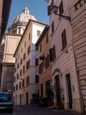 a building with a dome on top of a building at Navona Little Home in Rome