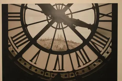 a close up of a clock tower with a city in the background at Re di Luna B&B in Rome
