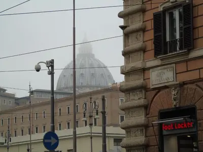 a view of a building with a domed building at Room Inn Vatican in Rome