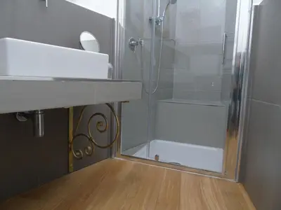 a bathroom with a shower and a sink and a shower at Room Inn Vatican in Rome