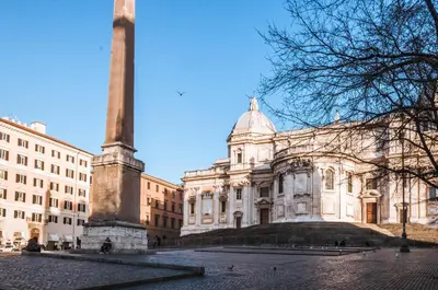 a large building with a monument in front of it at Hotel Leone in Rome