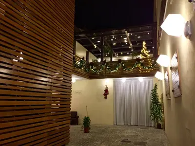 a lobby with a christmas tree and a white curtain at Aeterno Eco Guest House in Rome