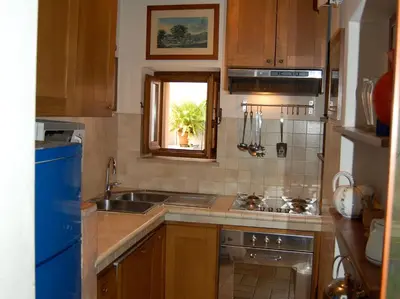 a small kitchen with a sink and a window at Casa Paradiso in Rome