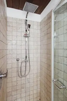 a shower in a tiled bathroom with at Casa Paradiso in Rome