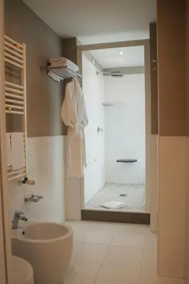 a bathroom with a shower and a sink and a toilet at Hotel Villa Maria Regina in Rome
