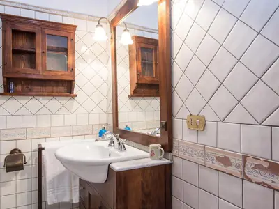 a bathroom with a sink and a mirror at Apartment Spanish Steps by Interhome in Rome