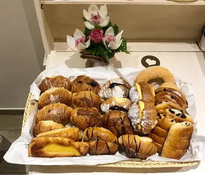 a box of different types of pastries and bread at Casa Mia Vaticano Guest House in Rome