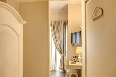 a room with a window and a desk with a computer at Casa Mia Vaticano Guest House in Rome