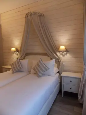 a bedroom with two beds and two night stands at Casa Tua Vaticano Guest House in Rome