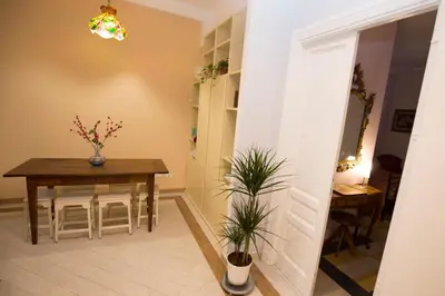 a dining room with a table and a table and chairs at Giubiliana in Rome