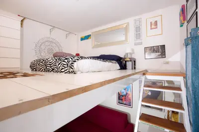 a bedroom with a bed and a counter top at Sweet Dream Penthouse in Rome