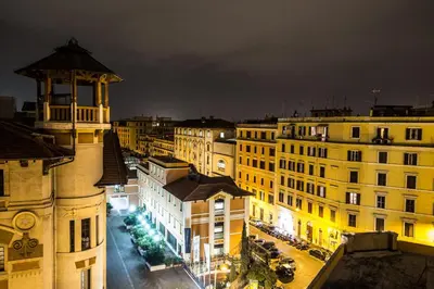 a view of a city at night with buildings at Sweet Dream Penthouse in Rome