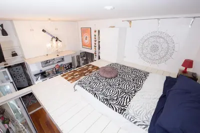 a bedroom with a large bed in the middle of it at Sweet Dream Penthouse in Rome