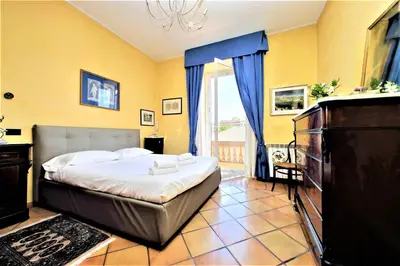 a bedroom with a bed and a television in it at Bellezza Al Colosseo - B&B & Apts in Rome