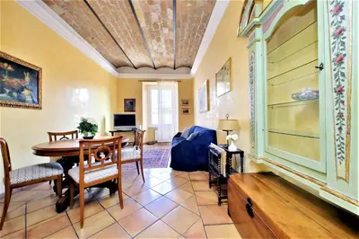 a living room with a table and chairs and a couch at Bellezza Al Colosseo - B&B & Apts in Rome