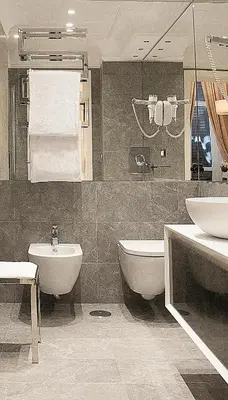 a bathroom with a sink and a tub and a toilet at Hotel Scalinata Di Spagna in Rome