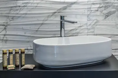 a white sink sitting on top of a counter at Spagna Luxury'n Trevi in Rome