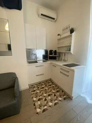 a kitchen with a sink and a counter at Mc - Piazza Mancini in Rome