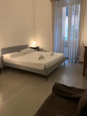 a bedroom with a bed and a window at Mc - Piazza Mancini in Rome