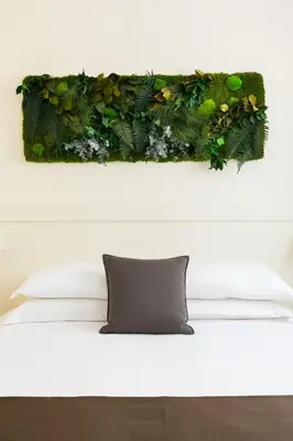a painting of a plant on a wall at Borghetto Guest House in Rome