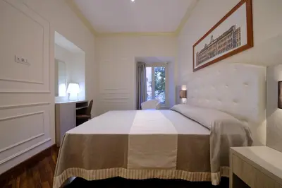 a bedroom with a large bed in a room at Lory House in Rome