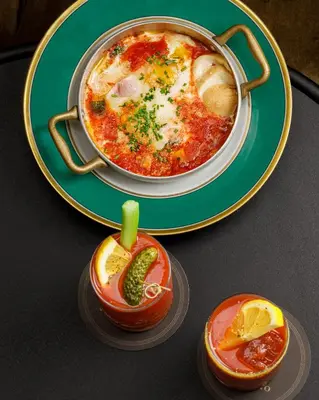 a plate of food on a table with a bowl of food at Hotel Locarno in Rome