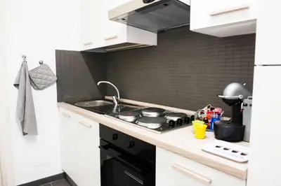 a kitchen with a stove and a sink at Casa Brunetti in Rome