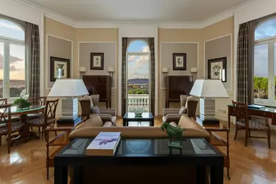 a living room with a couch and a table at Rome Marriott Grand Hotel Flora in Rome
