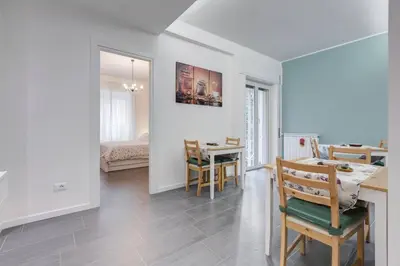 a kitchen and dining room with a table and chairs at AV Domus Vatican St.Peter B&B in Rome