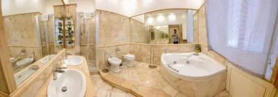 a large bathroom with two sinks and a tub at B&B Arco Di Gallieno in Rome