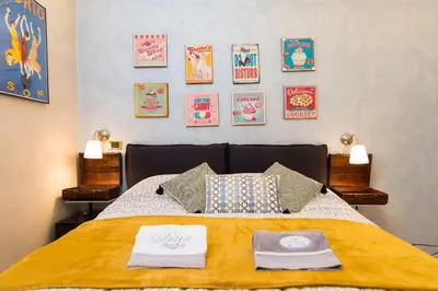 a bedroom with a bed with two towels on it at B&B Arco Di Gallieno in Rome