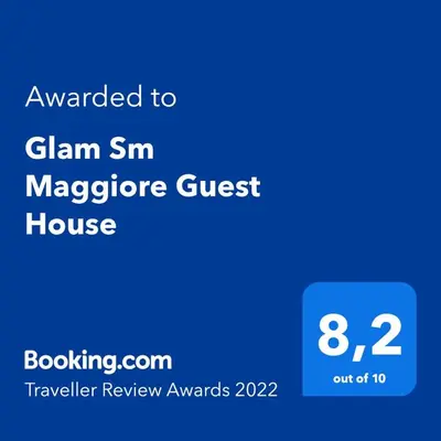 a screenshot of a cell phone with the text awarded to clam sneper guest house at Glam Sm Maggiore Guest House in Rome
