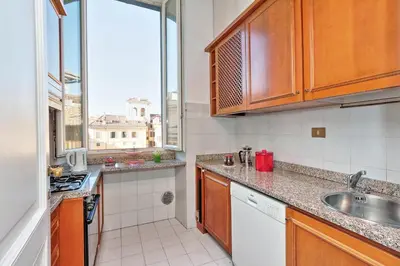 a small kitchen with a sink and a window at Pantheon Family Romantic Suite in Rome
