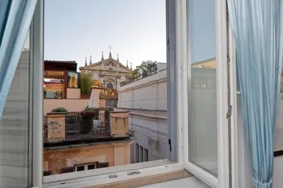 an open window with a view of a building at Pantheon Family Romantic Suite in Rome