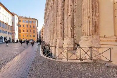 a building in a city with people walking on a street at Pantheon Family Romantic Suite in Rome