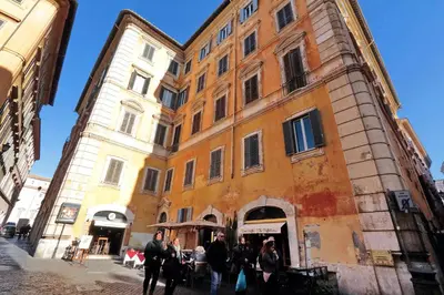 a group of people walking in front of a building at Pantheon Family Romantic Suite in Rome