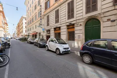 a row of cars parked on the side of a street at Rome Apartment with terrace Autonomous in Rome