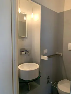 a bathroom with a sink and a toilet at Spain Apartments in Rome