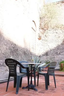 a table and chairs sitting on a patio at Agrippa's Terrace in Rome