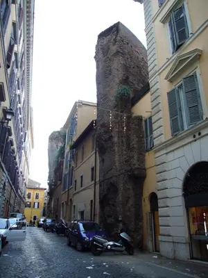 a street with buildings and a motorcycle parked on a street at Agrippa's Terrace in Rome