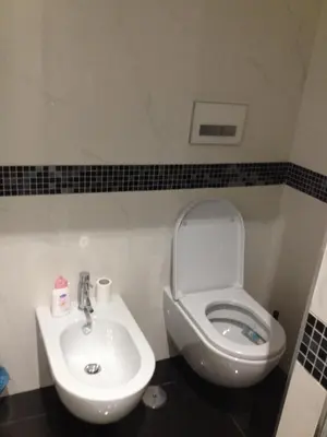 a bathroom with a toilet and a sink at Guest House Hello Roma in Rome