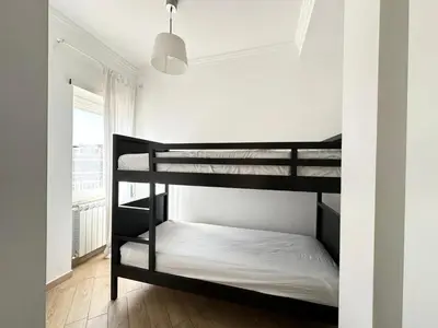 a bedroom with two bunk beds in a room at Terrazza sul Parco in Rome